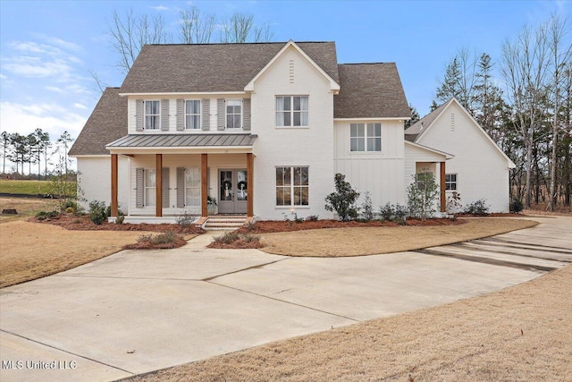 view of front facade with a porch and a front lawn