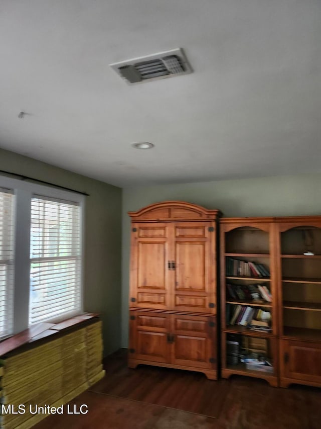 interior space with dark hardwood / wood-style floors