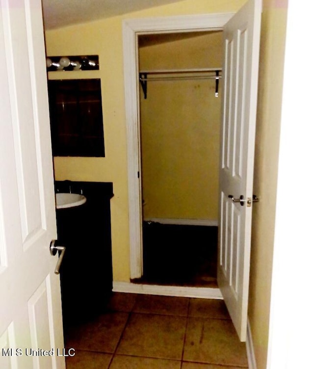 interior space featuring tile patterned flooring and vanity