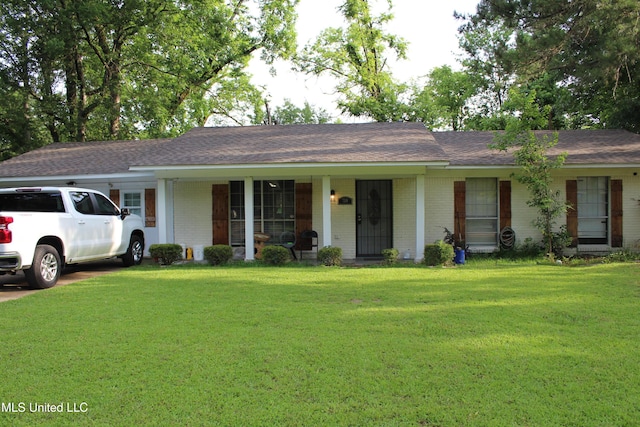 710 Benning Rd, Jackson, MS 39206 - ranch-style house with brick siding, a porch, a front lawn, and roof with shingles