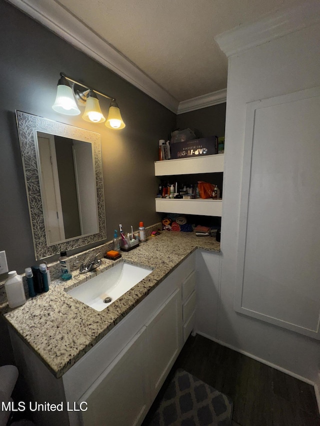 710 Benning Rd, Jackson, MS 39206 - bathroom with ornamental molding, vanity, and wood finished floors