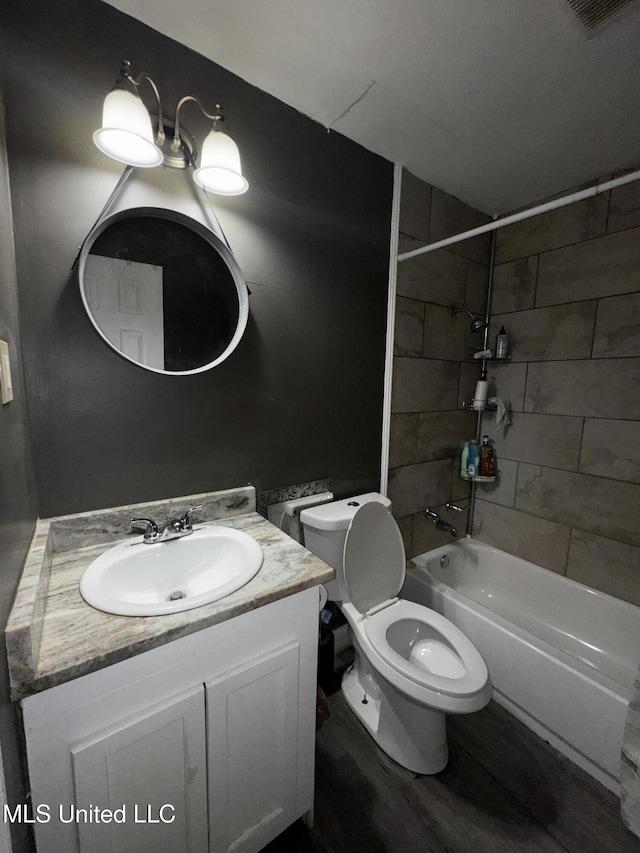 710 Benning Rd, Jackson, MS 39206 - bathroom with  shower combination, vanity, toilet, and wood finished floors