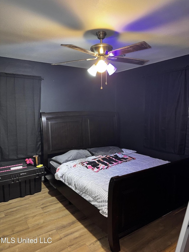 710 Benning Rd, Jackson, MS 39206 - bedroom with wood finished floors and ceiling fan