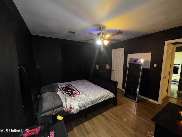 710 Benning Rd, Jackson, MS 39206 - bedroom featuring wood finished floors, ceiling fan, and baseboards