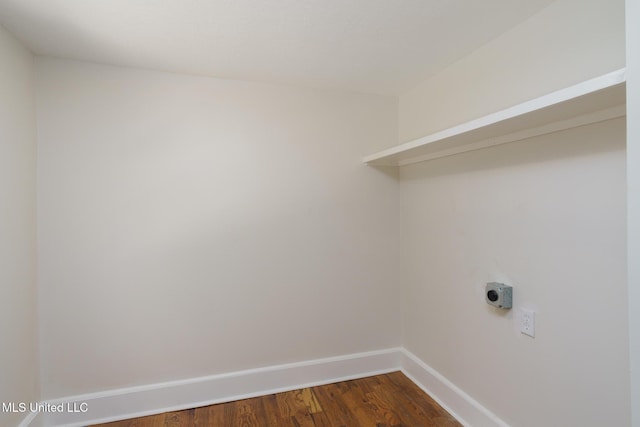 washroom with baseboards, laundry area, dark wood-style floors, and hookup for an electric dryer