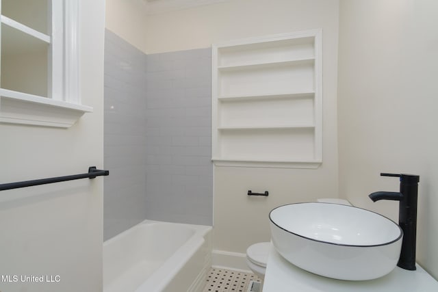 full bathroom with toilet, baseboards, and shower / bathtub combination