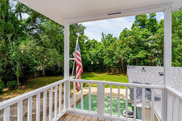 deck featuring a lawn and a fenced backyard