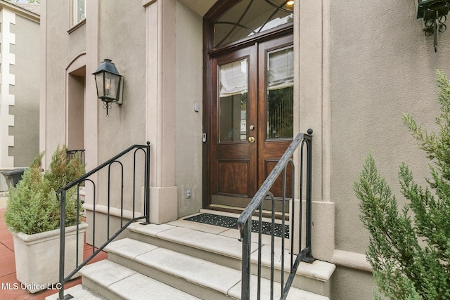 property entrance featuring french doors