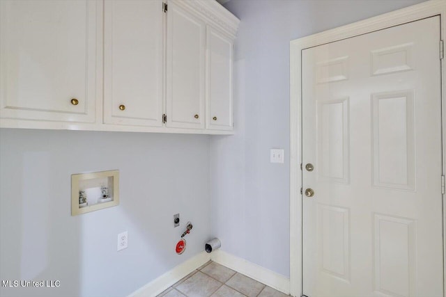 laundry room with hookup for an electric dryer, hookup for a gas dryer, washer hookup, baseboards, and cabinet space