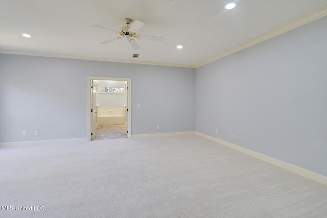 unfurnished room featuring ornamental molding, recessed lighting, light carpet, and baseboards