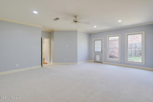 spare room featuring ornamental molding, plenty of natural light, recessed lighting, and baseboards