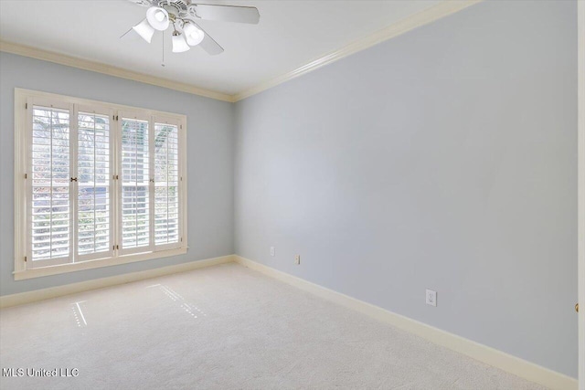 spare room with baseboards, ceiling fan, light colored carpet, and crown molding