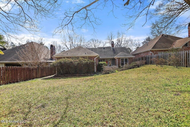 view of yard featuring a fenced backyard