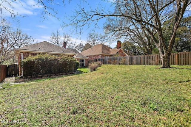 view of yard featuring a fenced backyard