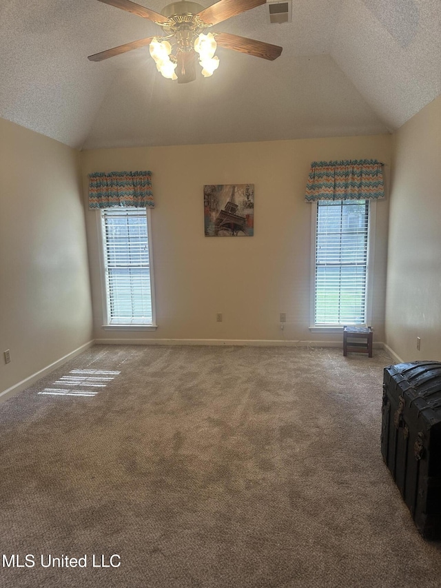 5875 White Ridge Cir W, Olive Branch, MS 38654 - unfurnished room with vaulted ceiling, plenty of natural light, ceiling fan, carpet floors, and baseboards