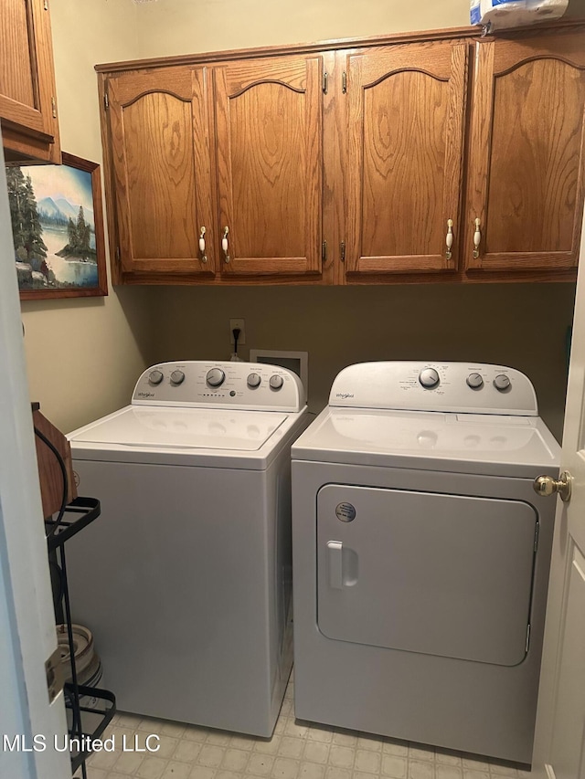 5875 White Ridge Cir W, Olive Branch, MS 38654 - laundry room with cabinet space, washing machine and dryer, and light floors