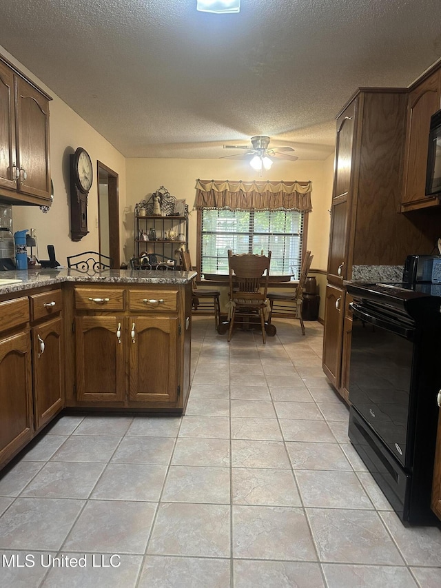 5875 White Ridge Cir W, Olive Branch, MS 38654 - kitchen featuring black / electric stove, a textured ceiling, light tile patterned flooring, a ceiling fan, and a peninsula