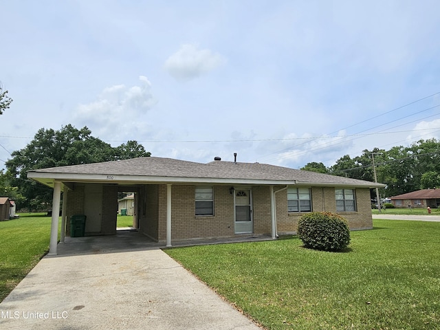 800 S Main St, Picayune, MS 39466 - ranch-style house featuring concrete driveway, a front lawn, brick siding, an attached carport, and a shingled roof