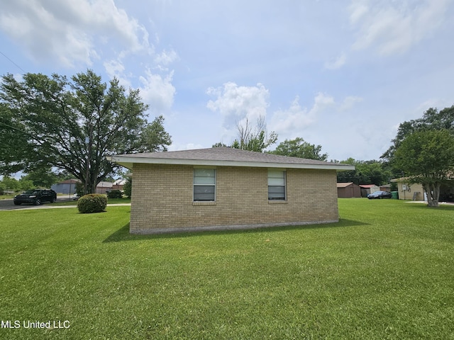 800 S Main St, Picayune, MS 39466 - view of side of property featuring brick siding and a yard