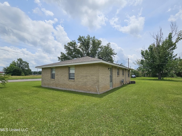 800 S Main St, Picayune, MS 39466 - view of side of property with brick siding and a lawn