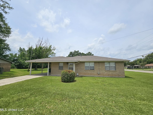 800 S Main St, Picayune, MS 39466 - view of front of house with brick siding, driveway, a front lawn, and an attached carport