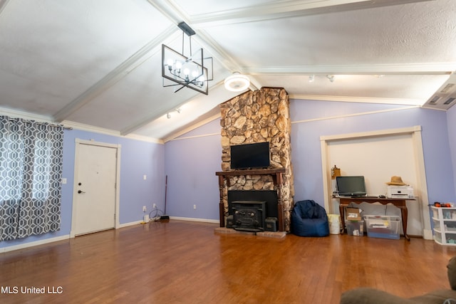 living room with crown molding, lofted ceiling with beams, a notable chandelier, dark hardwood / wood-style floors, and a wood stove