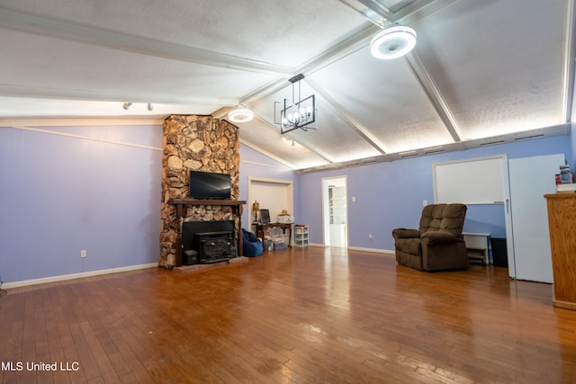 living room featuring a fireplace, hardwood / wood-style floors, lofted ceiling with beams, and a chandelier