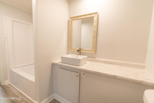 bathroom featuring hardwood / wood-style floors and vanity