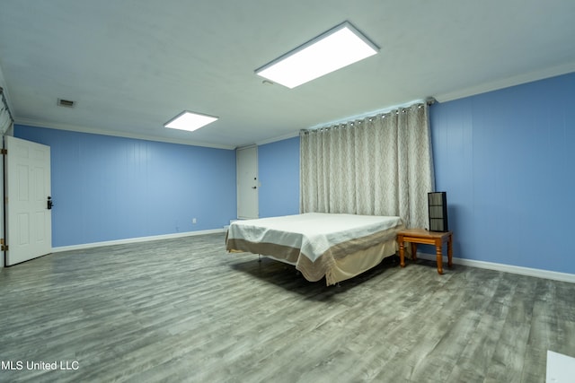 bedroom with hardwood / wood-style floors, ornamental molding, and pool table