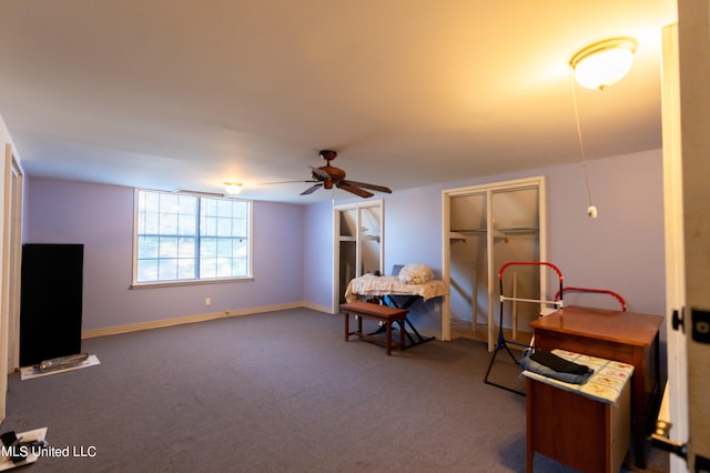 miscellaneous room with ceiling fan and carpet floors