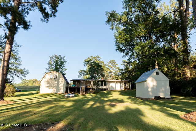 view of yard featuring a shed and a deck