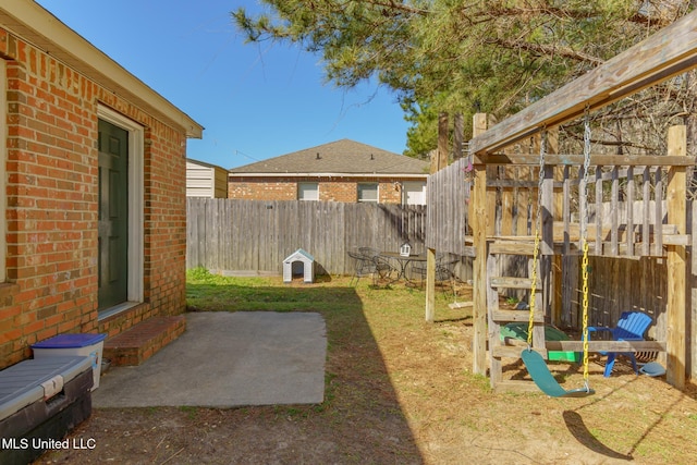 view of yard with a fenced backyard and a patio