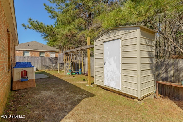 view of shed with a fenced backyard