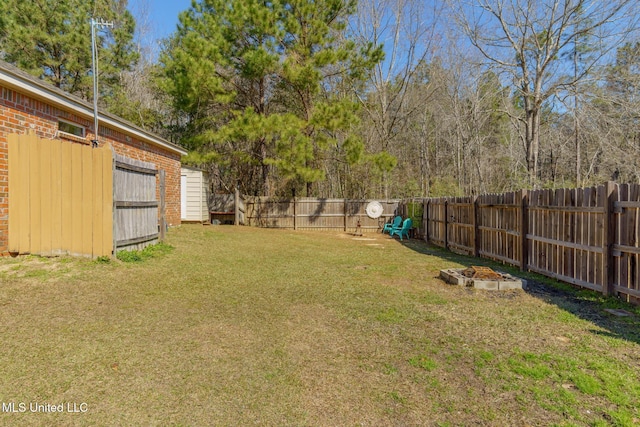 view of yard with a fenced backyard