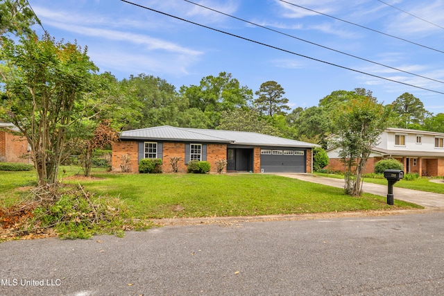 ranch-style home with brick siding, metal roof, a garage, driveway, and a front lawn