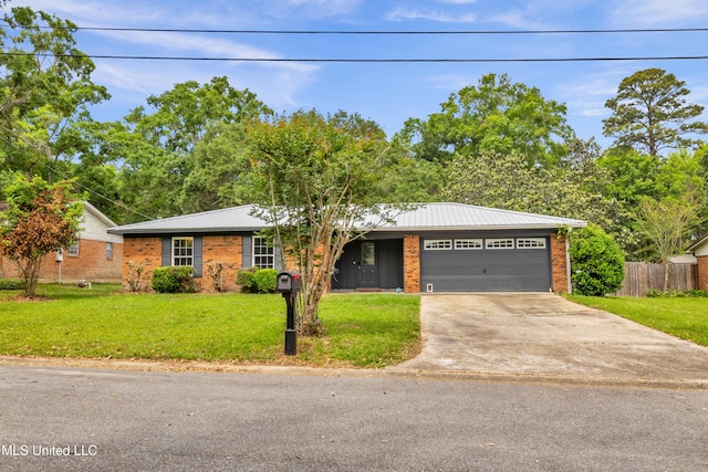 single story home with concrete driveway, fence, a front lawn, brick siding, and a garage