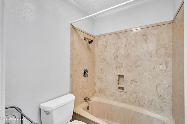 full bath featuring toilet, a textured ceiling, and shower / bathing tub combination