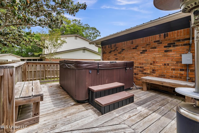 wooden terrace with a hot tub