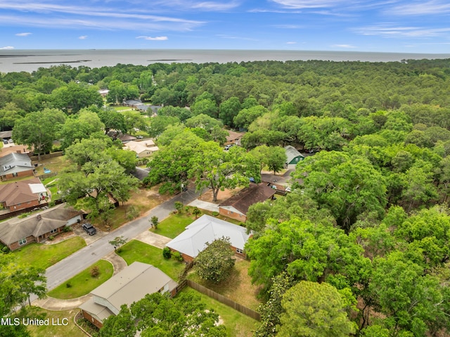 aerial view with a water view, a forest view, and a residential view