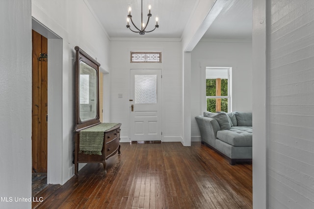 21021 Old River Rd, Vancleave, MS 39565 - entrance foyer with dark wood finished floors, a chandelier, and ornamental molding