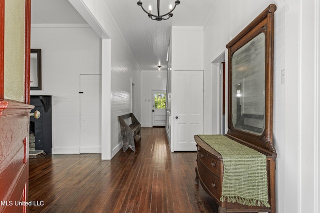 21021 Old River Rd, Vancleave, MS 39565 - foyer entrance with crown molding, dark wood-style floors, a chandelier, and baseboards