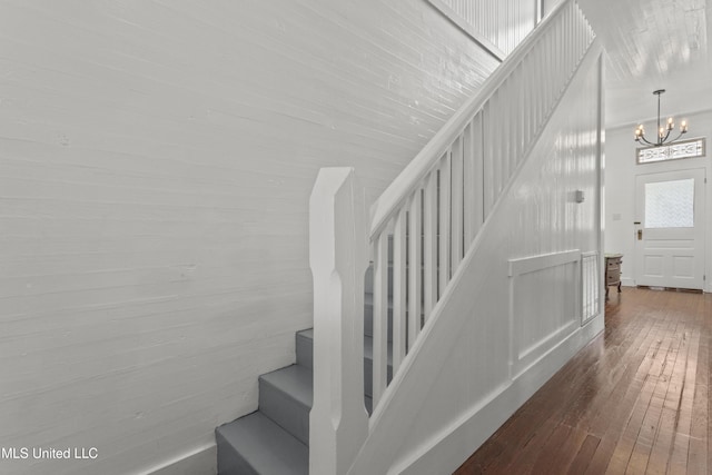 21021 Old River Rd, Vancleave, MS 39565 - stairway featuring wood-type flooring and a chandelier