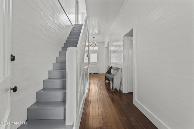 21021 Old River Rd, Vancleave, MS 39565 - stairway with hardwood / wood-style floors, a chandelier, and baseboards