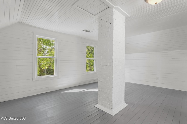 21021 Old River Rd, Vancleave, MS 39565 - additional living space with wood-type flooring, vaulted ceiling, decorative columns, and wood walls