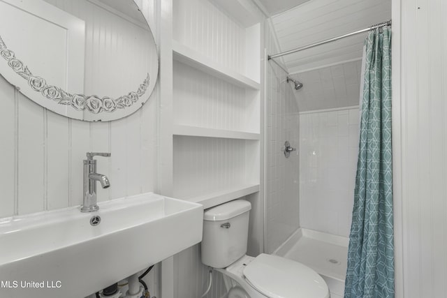 21021 Old River Rd, Vancleave, MS 39565 - bathroom featuring a sink, a stall shower, and toilet