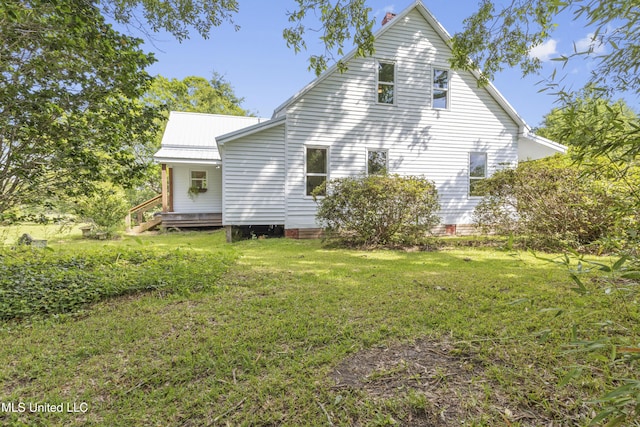 21021 Old River Rd, Vancleave, MS 39565 - view of side of home with a yard and metal roof