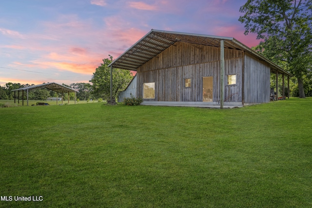 21021 Old River Rd, Vancleave, MS 39565 - outdoor structure at dusk featuring a yard and a detached carport
