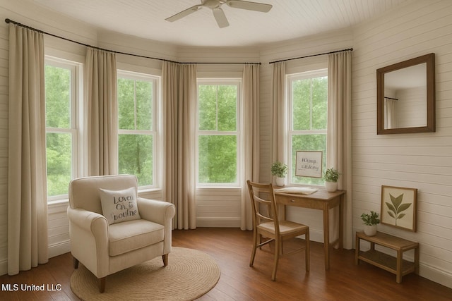 21021 Old River Rd, Vancleave, MS 39565 - living area with wood finished floors, healthy amount of natural light, a ceiling fan, and wood walls