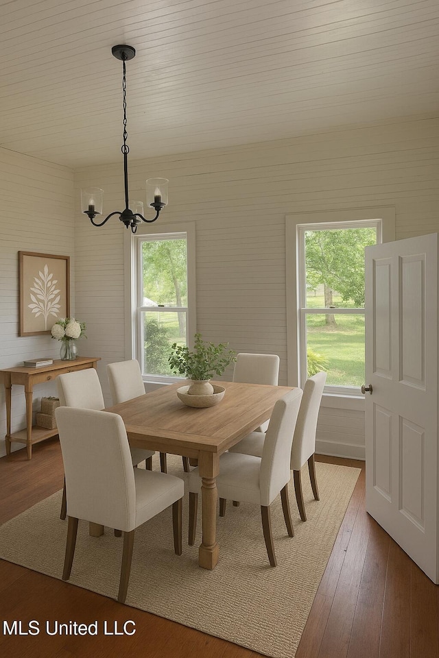 21021 Old River Rd, Vancleave, MS 39565 - dining room with a chandelier and wood-type flooring