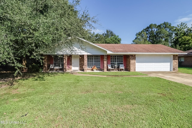 ranch-style home with a front lawn, covered porch, and a garage